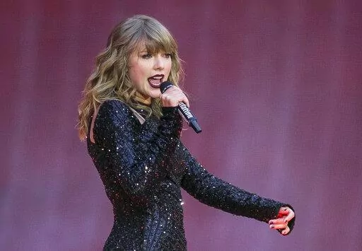 Singer Taylor Swift performs on stage in a concert at Wembley Stadium on June 22, 2018, in London. On the heels of a messy ticket roll out for Swift’s first tour in years, fans are angry; they’re also energized against Ticketmaster. While researchers agree that there’s no way to tell how long the energy could last, the outrage shows a way for young people to become more politically engaged through fan culture. (Photo by Joel C Ryan/Invision/AP, File)