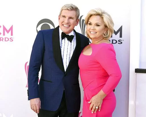 Todd Chrisley, left, and his wife, Julie Chrisley, pose for photos at the 52nd annual Academy of Country Music Awards on April 2, 2017, in Las Vegas. Todd and Julie Chrisley were driven by greed as they engaged in an extensive bank fraud scheme and then hid their wealth from tax authorities while flaunting their lavish lifestyle, federal prosecutors said, arguing the reality television stars should receive lengthy prison sentences. They were found guilty on federal charges in June and are set to