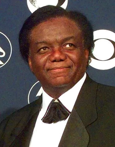 Songwriter/producer Lamont Dozier appears at the 40th Annual Grammy Awards in New York on Feb. 25, 1998. Dozier, of the celebrated Holland-Dozier-Holland team that wrote and produced “You Can’t Hurry Love,” “Heat Wave” and dozens of other hits and helped make Motown an essential record company of the 1960s and beyond, has died at age 81.  (AP Photo/Richard Drew, File)