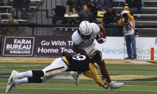 South Alabama Receiver Devin Voisin tries to break the tackle from Southern Miss Safety Camron Harrell in the first half of an NCAA college football game on Saturday, Nov. 19, 2022, in Hattiesburg, Miss. (Aimee Cronan/The Gazebo Gazette via AP)