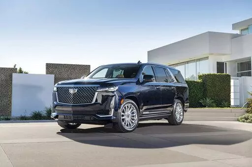 This photo provided by Cadillac shows the 2022 Cadillac Escalade, which offers an impressive max cargo room of 121 cubic feet and a useful hands-free driving system. (Jessica Lynn Walker/Cadillac via AP)