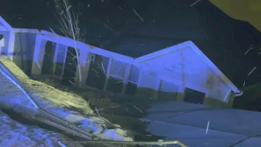 This image provided by the City of Draper, Utah, shows one of two unstable homes that collapsed down a hill in Draper, Utah on Saturday, April 22, 2023. No one was injured when the unoccupied houses broke apart. Officials, who had ordered occupants of the two homes to evacuate the properties in late October 2022, say the homes had been in danger due to sliding that resulted from shifting ground and breaks in the foundations. (City of Draper, Utah, via AP)