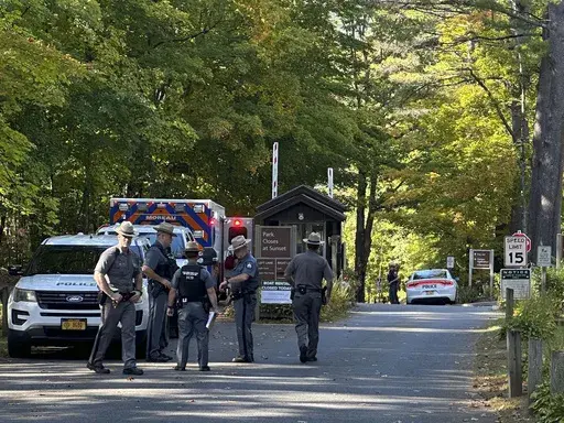 Police secure the entrance to Moreau Lake State Park as search continues for Charlotte Sena, a missing 9-year-old girl who had been camping over the weekend with her family at the park, Monday Oct. 2, 2023, in New York. (AP Photo/Michael Hill, File)