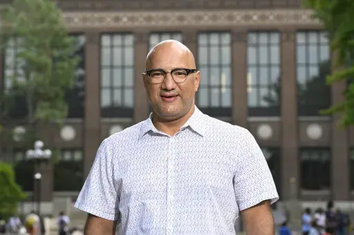 Jerusalem Garden restaurant owner and operator Ali Ramlawi stands on the campus of the University of Michigan, Thursday, Aug. 29, 2024, in Ann Arbor, Mich. (AP Photo/Jose Juarez)