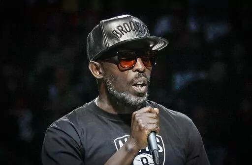 Actor Michael K. Williams introduces the Brooklyn Nets starting lineup during NBA basketball first-round playoffs Friday, April 25, 2014, in New York. A federal prosecutor said Wednesday, Feb. 2, 2022, four men have been charged in the overdose death of Williams, who gained fame playing Omar Little on "The Wire." (AP Photo/Frank Franklin II, File)
