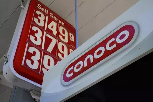 A Conoco gas station sign is shown in Glenside, Pa., Sept. 29, 2021. ConocoPhillips is buying Marathon Oil in an all-stock deal valued at approximately $17.1 billion as energy prices soar and big oil companies reap massive profits.(AP Photo/Matt Rourke, File)