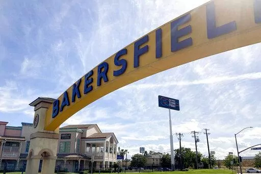 A sign for Bakersfield, Calif., is displayed over Sillect Avenue at Buck Owens Boulevard on April 20, 2022. House Republican leader Kevin McCarthy is a son of California’s Central Valley, a farming and oil-pumping heartland. It's a swath of rural conservatism amid California’s progressive politics and it's Donald Trump's slice of California. It's here that McCarthy launched his political rise. (AP Photo/Lisa Mascaro)