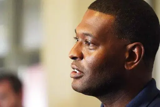 Environmental Protection Agency Administrator Michael Regan discusses elements of a coordinated response of federal, state and city agencies, that he hopes will help deal with the city's long-standing water problems, during a news briefing, Sept. 7, 2022, in Jackson, Miss. The Biden administration is proposing lower limits for a deadly air pollutant, saying tougher standards for soot from tailpipes, smokestacks and wildfires could prevent thousands of premature deaths a year. (AP Photo/Rogelio V