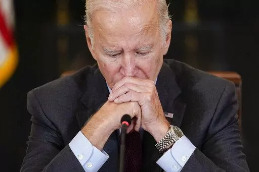 President Joe Biden listens to doctors speak during a meeting of the reproductive rights task force in the State Dining Room of the White House in Washington, Tuesday, Oct. 4, 2022. (AP Photo/Susan Walsh)