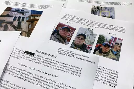The statement of facts to support the arrest warrant for Rodney Milstreed of Finksburg, Md., is photographed Tuesday, May 24, 2022 in Washington. (AP Photo/Jon Elswick, File)
