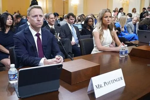 Matt Pottinger, former deputy national security adviser, and Sarah Matthews, former White House deputy press secretary, return from a break as they testify as the House select committee investigating the Jan. 6 attack on the U.S. Capitol holds a hearing at the Capitol in Washington, Thursday, July 21, 2022. (AP Photo/Patrick Semansky)
