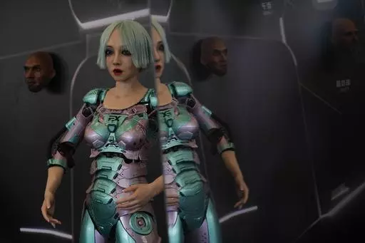 A human-like robot performs near robots of faces that mimic human expressions during the annual World Robot Conference at the Etrong International Exhibition and Convention Center on the outskirts of Beijing, Thursday, Aug. 17, 2023. (AP Photo/Andy Wong)