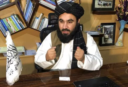 Education Ministry spokesman Mawlvi Aziz Ahmad Rayan speaks during an interview with The Associated Press in Kabul, Afghanistan, Wednesday, March 23, 2022. Afghanistan's Taliban rulers unexpectedly decided against reopening schools Wednesday to girls above the sixth grade, reneging on a promise and opting to appease their hard-line base at the expense of further alienating the international community. (AP Photo/Mohammed Shoaib Amin)