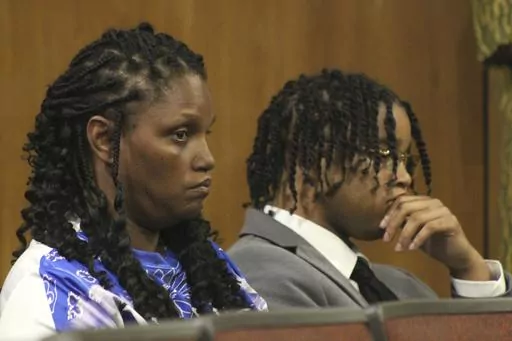 CAPTION CORRECTION: CORRECTS SPELLING OF NAME: D'Monterrio Gibson, right, and his mother, Sharon McClendon, await the start of the trial of two white men charged in an attack on Gibson, a FedEx employee who was making a delivery, Thursday, Aug. 17, 2023, in Brookhaven, Miss. The judge declared a mistrial of the men who were charged with attempted first-degree murder, conspiracy and shooting into the vehicle driven by Gibson. (Hunter Cloud/The Daily Leader via AP)