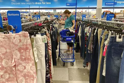 In this July 21, 2021 photo, a consumer shops at a retail store in Morton Grove, Ill. The fastest inflation in 40 years squeezed retailers during the first quarter, alarming investors worried about the broader economy's outlook. Earnings reports from  Walmart, Target and Amazon this month showed higher costs are hurting retailers' operations. (AP Photo/Nam Y. Huh)