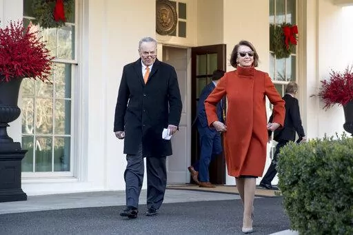 House Minority Leader Nancy Pelosi of Calif., right, and Senate Minority Leader Sen. Chuck Schumer of N.Y., left, walk out of the West Wing to speak to members of the media outside of the White House in Washington, Dec. 11, 2018, following a meeting with President Donald Trump. Pelosi's decision to step down from Democratic leadership after 20 years has many women admiring the way she wielded power. (AP Photo/Andrew Harnik, File)