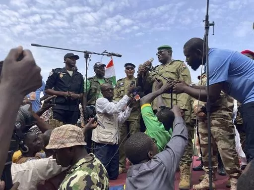 Mohamed Toumba, one of the soldiers who ousted Nigerian President Mohamed Bazoum, addresses supporters of Niger's ruling junta in Niamey, Niger, Sunday, Aug. 6, 2023. The U.S. is making precautionary plans to evacuate two key drone and counter-terror bases in Niger if that becomes necessary under the West African nation’s new ruling junta. That word came Friday, Aug. 18, from the Air Force commander for Africa, Gen. James Hecker. The Air Force general stressed to reporters in Washington that t