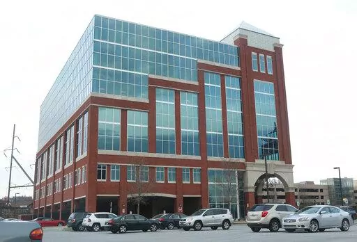 FILE- This April 2, 2014, file photo, shows the headquarters of student loan debt collector Navient Corporation, in Wilmington, Del. Pennsylvania's attorney general says the large student loan servicer Navient has settled allegations of predatory practices for $1.85 billion. Attorney General Josh Shapiro said Thursday, Jan. 13, 2022 in a news release that the settlement includes $1.7 billion in debt cancellation and $95 million in restitution. (William Bretzger/The Wilmington News-Journal via AP