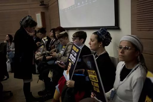 Relatives and supporters of Israelis held hostage by Hamas attend a committee hearing at the Knesset, Israel's parliament, in Jerusalem, Monday, Feb. 5, 2024. Across Israel, the chants of "Now! Now! Now!" ring out at nearly every protest imploring Israel's government to do everything possible to win the immediate release of dozens of hostages held by Hamas in Gaza. But a small group of families of hostages are pushing a different message: let the army first finish the job of defeating the milita