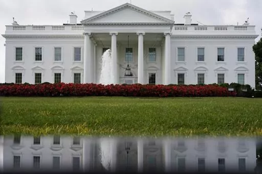 The White House is seen reflected in a puddle, Saturday, Sept. 3, 2022, in Washington. With roughly a year and a half until the 2024 presidential contest, the field of candidates is largely set. Former President Donald Trump and Florida Gov. Ron DeSantis have dominated the early Republican race, but other candidates including former Vice President Mike Pence, former United Nations Ambassador Nikki Haley and U.S. Sen. Tim Scott of South Carolina are looking for an opening in case either falters. 