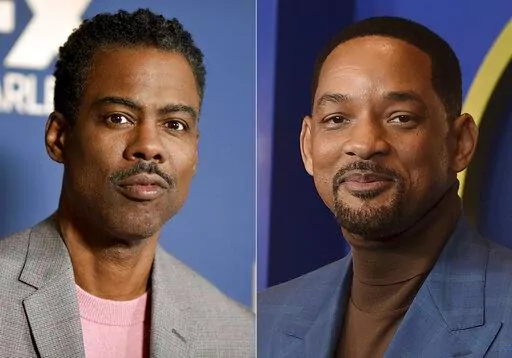 In this combo of file photos, Chris Rock, left, appears at the the FX portion of the Television Critics Association Winter press tour in Pasadena, Calif., on Jan. 9, 2020; and Will Smith appears at the 94th Academy Awards nominees luncheon in Los Angeles on March 7, 2022. Smith has again apologized to Chris Rock for slapping him during the Oscar telecast in a new video, saying that his behavior was “unacceptable” and revealing that he reached out to the comedian to discuss the incident but w