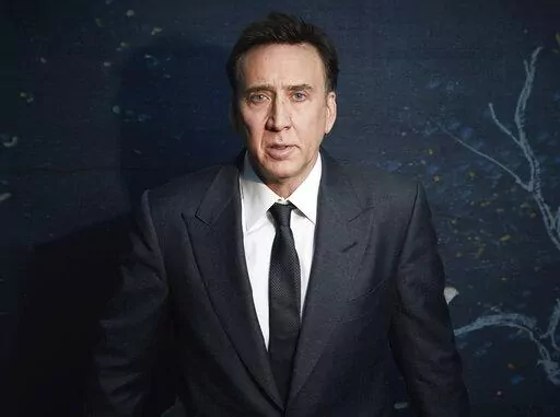 Nicolas Cage poses for a portrait to promote "The Unbearable Weight of Massive Talent" in New York on April 9, 2022. (Photo by Taylor Jewell/Invision/AP)