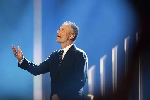 Mark Twain Prize recipient Jon Stewart is introduced at the start of the 23rd annual Mark Twain Prize for American Humor at the Kennedy Center for the Performing Arts on Sunday, April 24, 2022, in Washington. (AP Photo/Kevin Wolf)