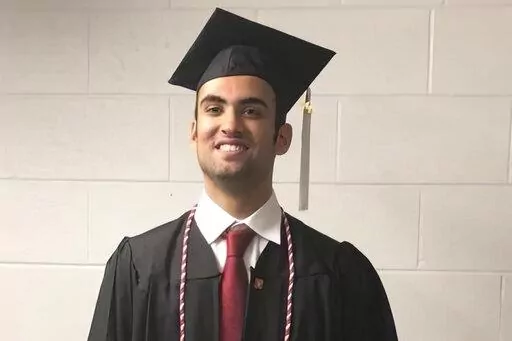 Prince Abdullah bin Faisal al Saud wears cap and gown for his undergraduate graduation from Northeastern University in Boston, in 2018. Tough prison sentences that Saudi Arabia has handed the Saudi student and a Saudi-American citizen suggest Saudi Crown Prince Mohammed bin Salman is maintaining or escalating a crackdown on Saudi dissidents in the West, Saudi exiles and rights groups say. The Saudi prince who was attending graduate school in Boston is the latest person targeted as part of what t