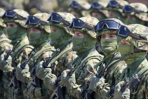Serbian Army soldiers perform during a military exercise, at Batajnica Air Base near Belgrade, Serbia, on April 22, 2023. Serbia on Friday, June 23, 2023 reiterated the threat of an armed intervention in its former province of Kosovo, unless the NATO-led peacekeepers stationed there don't protect the minority Serbs there from "the great terror" of the Kosovo "regime." Serbian army chief-of-staff, Gen. Milan Mojsilovic, said that the military stands ready to fulfil its tasks "in accordance to the