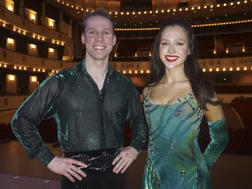 Siblings Fergus Fitzpatrick, left, and Anna Mai Fitzpatrick appear in costume for "Riverdance 30 — The New Generation." (Riverdance/Abhann Productions via AP)