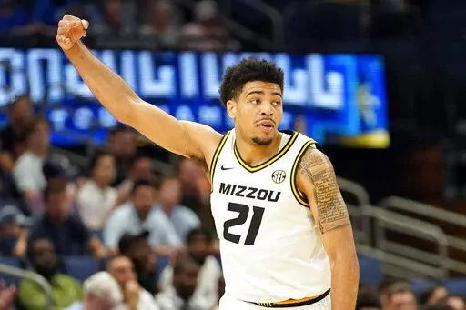 Missouri forward Ronnie DeGray III (21) celebrates after making a three-point basket during the first half of an NCAA men's college basketball Southeastern Conference tournament game against Mississippi Wednesday, March 9, 2022, in Tampa, Fla. (AP Photo/Chris O'Meara)