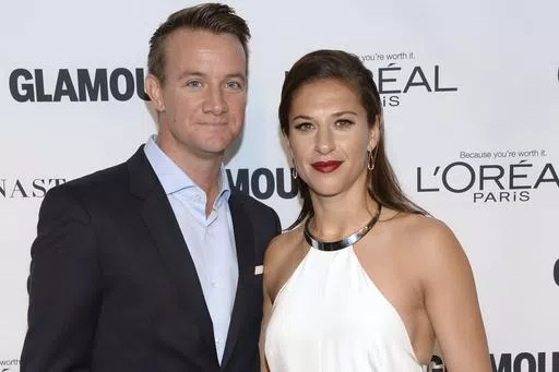 Brian Hollins, left, and Carli Lloyd attend the 25th annual Glamour Women of the Year Awards at Carnegie Hall on Monday, Nov. 9, 2015, in New York. Retired U.S. women's soccer star Carli Lloyd and her husband are expecting their first child in October. The 41-year-old Lloyd announced her pregnancy on Instagram on Wednesday, May 1, 2024. She has been married to Brian Hollins for seven years (Photo by Evan Agostini/Invision/AP, File)