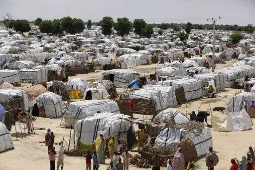 A top view of one of the biggest camp for people displaced by Islamist extremists in Maiduguri, Nigeria on Aug. 28, 2016. Droughts, flooding and a shrinking Lake Chad caused in part by climate change is fueling conflict and migration in the region and needs to better addressed, a report said Thursday, Jan. 19, 2023. ( AP Photo/Sunday Alamba, File)