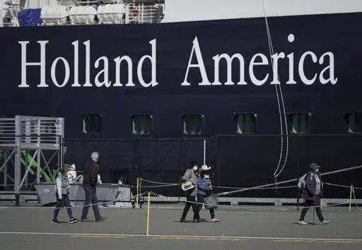 A Holland America cruise ship is shown in Victoria, Canada on Saturday, April 9, 2022. Two crew members on a Holland America cruise ship died during an “incident” in the ship's engineering space, the cruise line said. The unidentified crew members died Friday, March 22, 2024, while the Florida-based Nieuw Amsterdam was at Half Moon Cay in the Bahamas, Holland America said in a statement.(Darryl Dyck/The Canadian Press via AP)