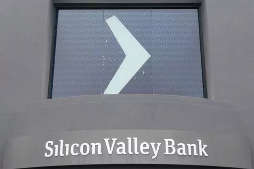 A Silicon Valley Bank sign is shown at the company's headquarters in Santa Clara, Calif., Friday, March 10, 2023. The Federal Deposit Insurance Corporation is seizing the assets of Silicon Valley Bank, marking the largest bank failure since Washington Mutual during the height of the 2008 financial crisis. The FDIC ordered the closure of Silicon Valley Bank and immediately took position of all deposits at the bank Friday. (AP Photo/Jeff Chiu)