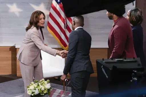 Democratic presidential nominee Vice President Kamala Harris, left, shaking hands with Gerren Keith Gaynor, center, as Eugene Daniels, second from the right, and Tonya Mosley, far right, look on after being interviewed by the National Association of Black Journalists at the WHYY studio in Philadelphia, Tuesday, Sept. 17, 2024. (AP Photo/Jacquelyn Martin)