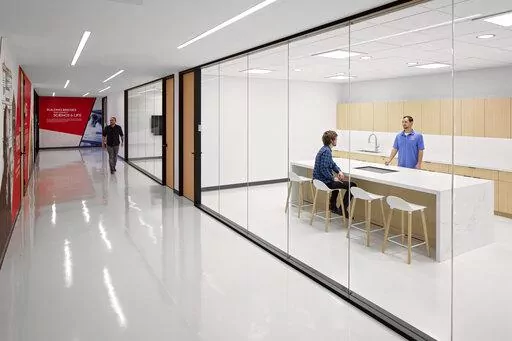 This undated photo provided by Ajinomoto Health & Nutrition shows the conference and work space at Ajinomoto Health & Nutrition in Itasca, Ill.  Francine Yoon, a 24-year-old food scientist at Ajinomoto Health and Nutrition NA  has been working mostly in person since the pandemic, including at her current job that she started last fall. But moving in last year with her older parents, both in their early 60s, has led to some heightened level of anxiety because she's worried about passing on the vi