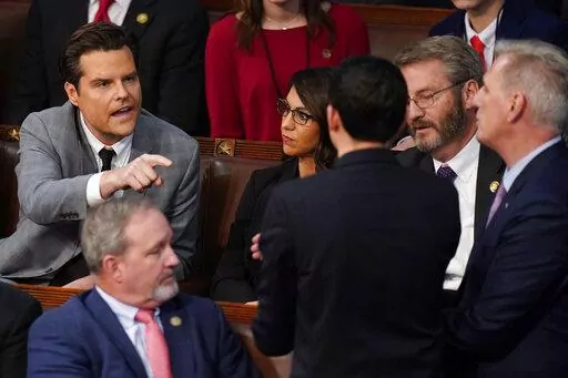 Rep. Matt Gaetz, R-Fla., left, talks to Rep. Kevin McCarthy, R-Calif., right, in the House chamber as the House meets for the fourth day to elect a speaker and convene the 118th Congress in Washington on Jan. 6, 2023. Some members of Congress are asking that the House floor be more fully open to cameras in the interest of transparency. (AP Photo/Alex Brandon, File)
