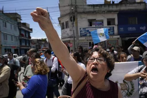 Protestors gather outside the Attorney General's office to protest its raid on the nation's electoral authority and in favor of the election results that called for a run-off presidential election in Guatemala City, Thursday, July 13, 2023. The Attorney General's Office announced on July 12 that a judge had suspended the legal status of the Seed Movement party, for alleged violations when it gathered the necessary signatures to form. The party's presidential candidate had been set to compete in 