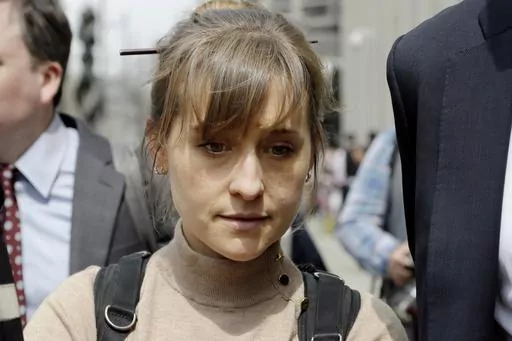 Television actor Allison Mack leaves federal court in the Brooklyn borough of New York, April 8, 2019, after pleading guilty to racketeering charges in a case involving a cult-like group based in upstate New York called NXIVM. Mack has been released from a California prison, according to a government website. Online records maintained by the Federal Bureau of Prisons said she was released Monday, July 3, 2023. (AP Photo/Mark Lennihan, File)