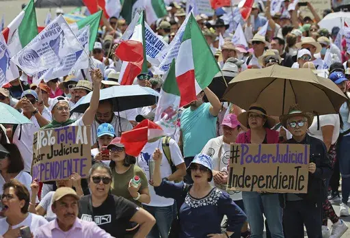 Federal court workers gather as they strike over reforms that would make all judges stand for election in Mexico City, Sunday, Aug. 25, 2024. (AP Photo/Ginnette Riquelme)