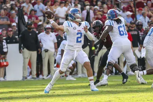 Mississippi quarterback Jaxson Dart (2) throws a pass for a first down during the first half of an NCAA college football game against South Carolina Saturday, Oct. 5, 2024, in Columbia, S.C. (AP Photo/Artie Walker Jr.)
