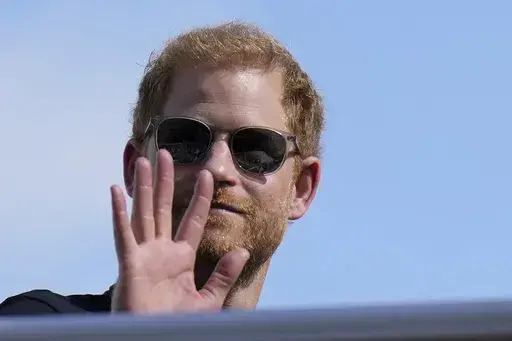 Britain's Prince Harry, the Duke of Sussex, waves during the Formula One U.S. Grand Prix auto race at Circuit of the Americas, on Oct. 22, 2023, in Austin, Texas. (AP Photo/Nick Didlick, File)