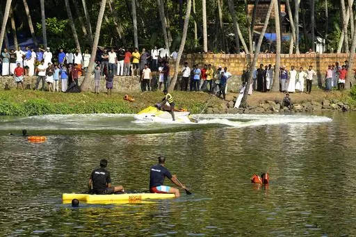 Rescuers on a boat search after a tourist boat capsized Sunday night in Malappuram, Kerala, India, Monday, May 8, 2023. More than a dozen were killed. (AP Photo/P.P. Afthab)
