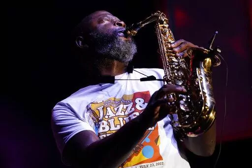 Mike Phillips performs at the Jefferson Street Jazz & Blues Festival July 23, 2022, in Nashville, Tenn. Hundreds of tourism-related projects nationwide, including the festival, collectively are getting about $2.4 billion from the American Rescue Plan, according to an Associated Press analysis of funds flowing from last year's wide-ranging coronavirus relief law. (AP Photo/Mark Humphrey)