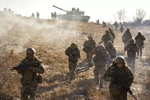 Ukrainian servicemen of the 3rd Separate Tank Iron Brigade take part in a drill, not far from the frontlines, in the Kharkiv area, Ukraine, Thursday, Feb. 23, 2023. Grueling artillery battles have stepped up in recent weeks in the vicinity of Kupiansk, a strategic town on the eastern edge of Kharkiv province by the banks of the Oskil River as Russian attacks intensifying in a push to capture the entire industrial heartland known as the Donbas, which includes the Donetsk and the Luhansk provinces