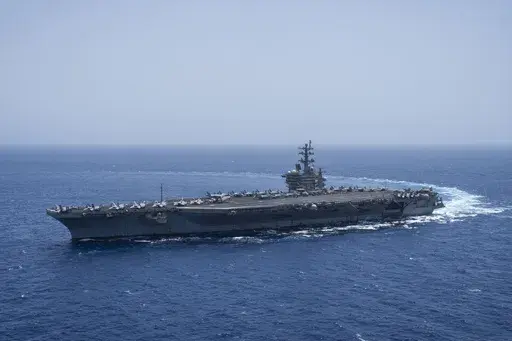 The USS aircraft carrier Dwight D. Eisenhower, also known as 'IKE', sails in the Red Sea on Wednesday, June 12, 2024. (AP Photo/Bernat Armangue, File)